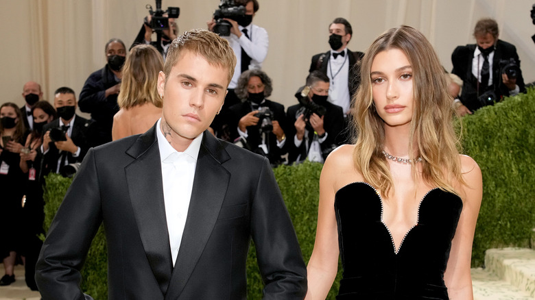 Justin Bieber and Hailey Baldwin posing on the Met Gala red carpet.