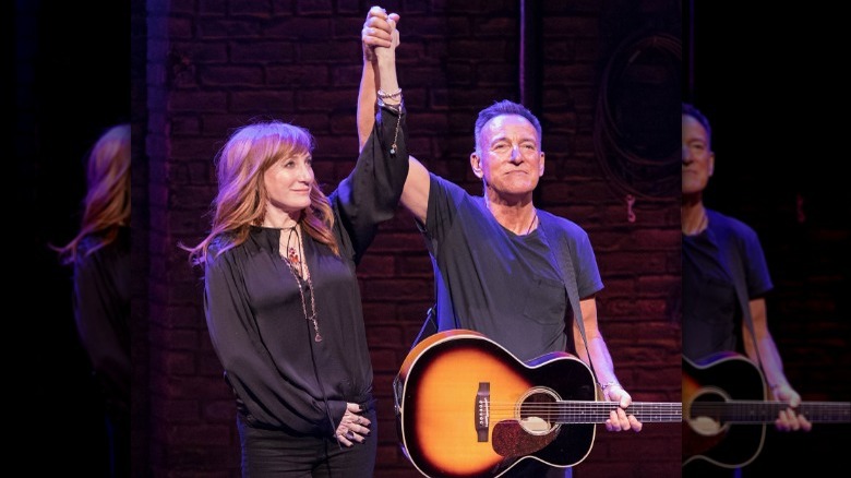 Patti Scialfa Bruce Springsteen holding hands