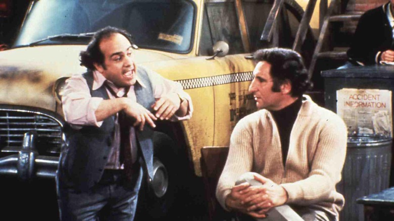 Danny DeVito as Louie De Palma and Judd Hirsch as Alex Reiger in Taxi
