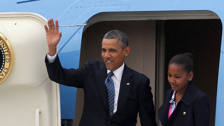 Barack and Sasha Obama leaving Air Force One