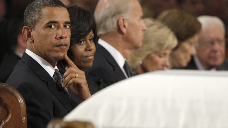 Barack and Michelle Obama at a funeral