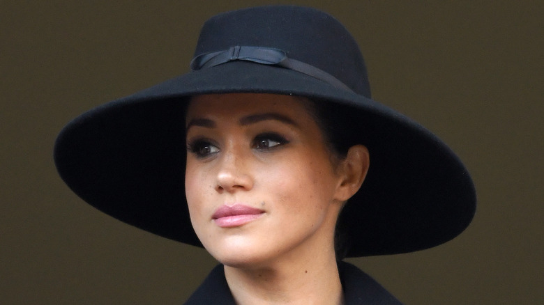 Meghan Markle wearing black hat