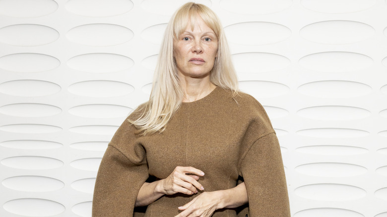 Pamela Anderson posing at the Vivienne Westwood Womenswear Spring/Summer 2024 show
