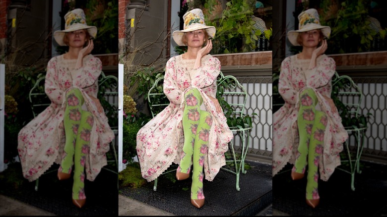 Pamela Anderson sitting in florals in New York City.