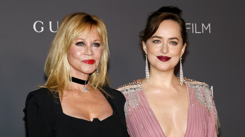 Melanie Griffith posing with daughter Dakota Johnson