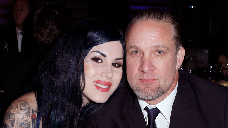 Kat Von D sitting at a table with Jesse James