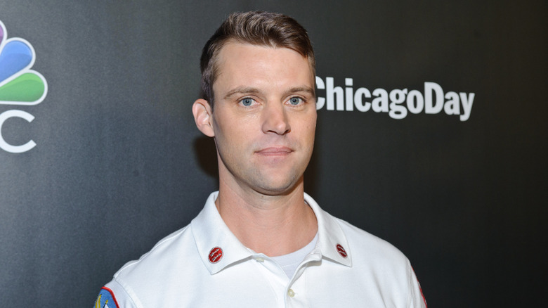 Jesse Spencer posing in front of black backdrop