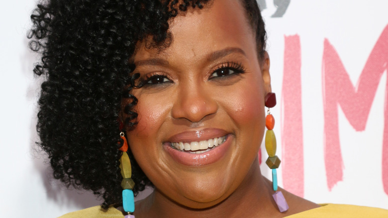 Natasha Rothwell smiles at an event