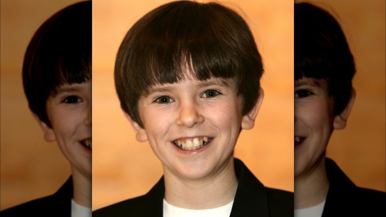 Young Freddie Highmore smiling