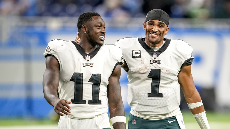 Jalen Hurts embraces A.J. Brown, both smiling