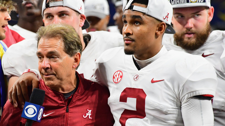 Jalen Hurts hugging coach Nick Saban