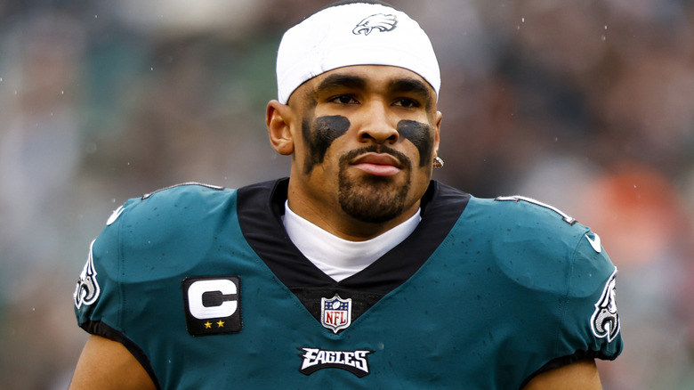 Jalen Hurts looking serious at a game