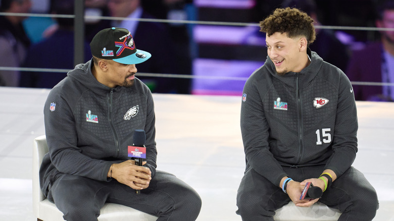 Jalen Hurts looks at Patrick Mahomes