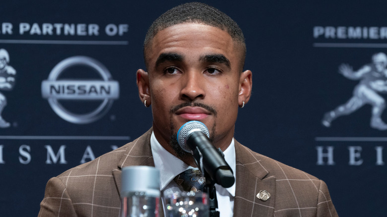 Jalen Hurts sitting in front of microphone