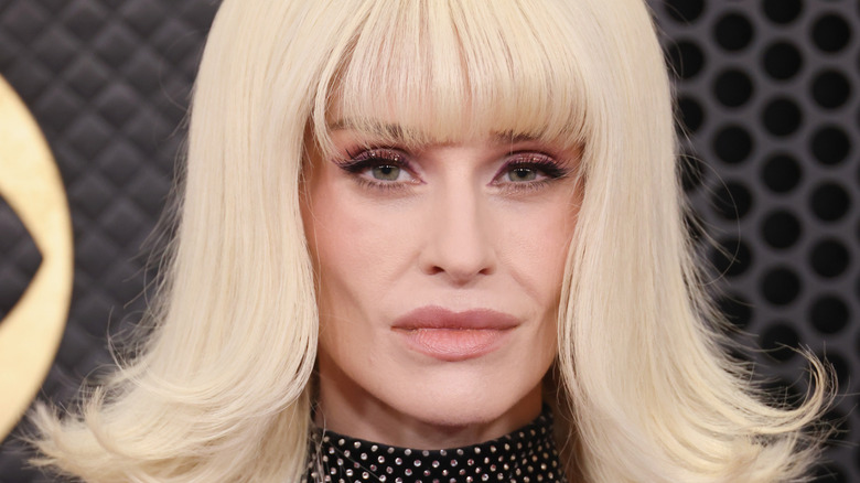 Kelly Osbourne poses for a photo