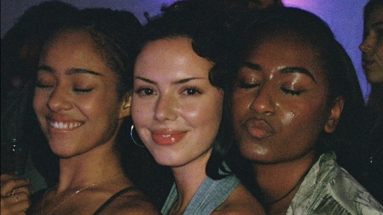 Sasha Obama displays a pout and show off her spiky lashes in a group photo.