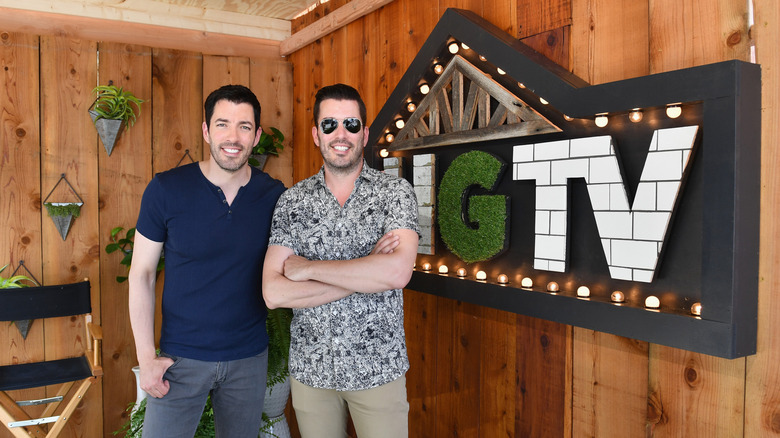 Property Brothers posing with HGTV sign