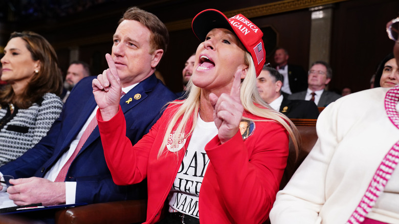 Marjorie Taylor Greene (R-GA) shouts at President Joe Biden as he delivers the State of the Union address before a joint session of Congress in the House chamber at the Capital building on March 7, 2024