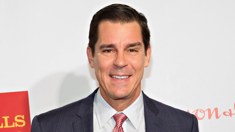 Billy Bean smiling at a charity event
