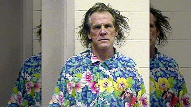 Nick Nolte frowning in mugshot