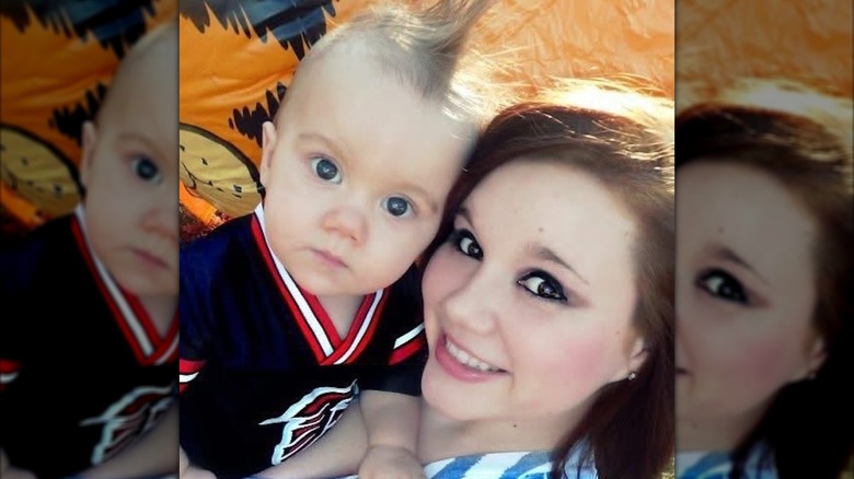 Sporting smoky eye makeup, Whitney Purvis smiles while leaning close to her late son, Weston Gosa Jr.