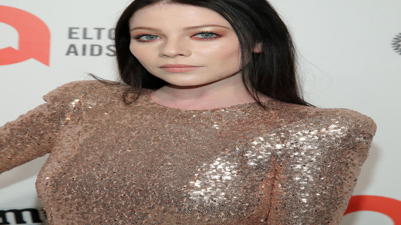 Michelle Trachtenberg posing at an event