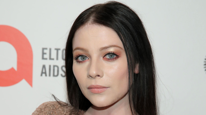 Michelle Trachtenberg posing at an event