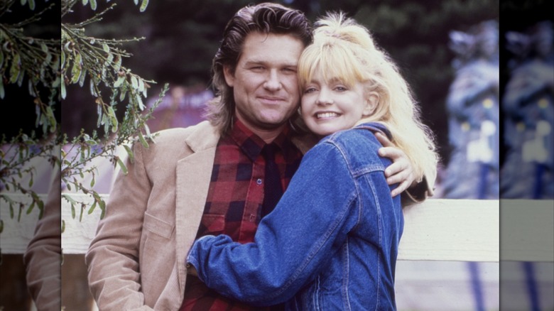 Goldie Hawn hugging Kurt Russell.