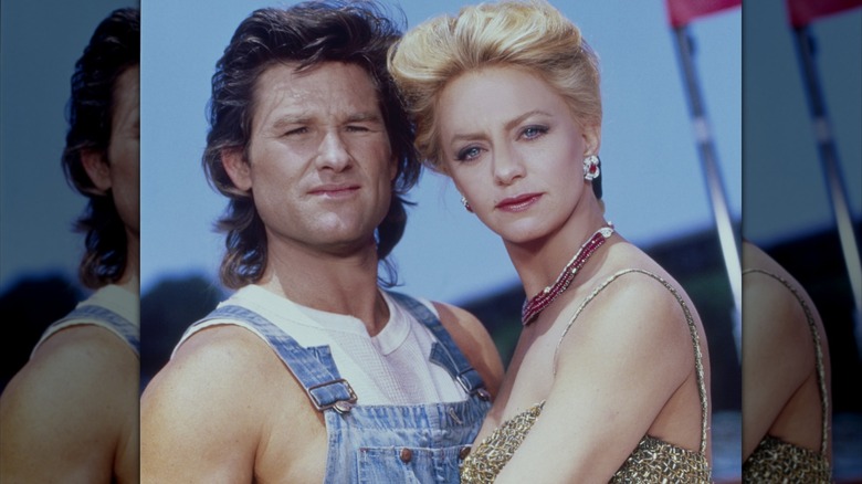 Kurt Russell posing with Goldie Hawn.