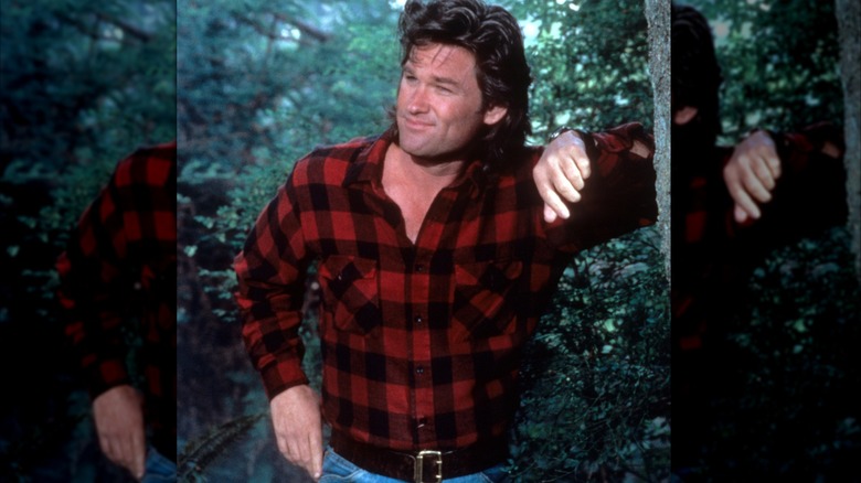 Kurt Russell posing outdoors.