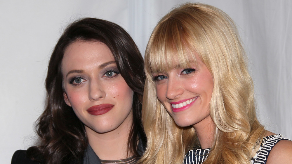 Kat Dennings and Beth Behrs on a red carpet