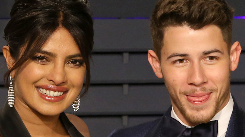 Priyanka Chopra and Nick Jonas smiling at event