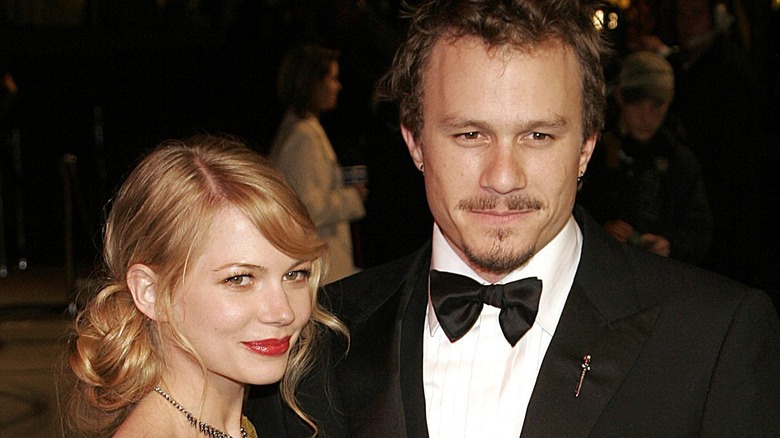 Michelle Williams and Heath Ledger staring