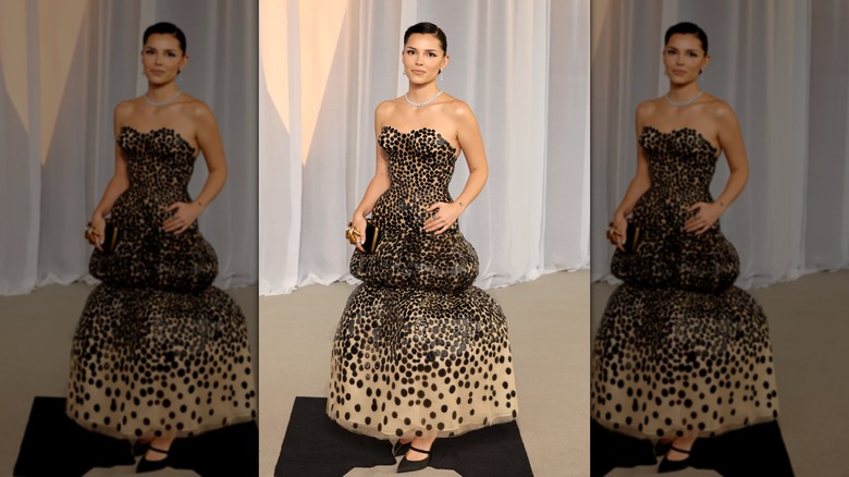 Inde Navarrette posing in a black dress at the 6th Annual Academy Museum Gala
