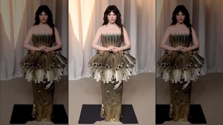 Sophie Thatcher wearing an all-gold ensemble at the 6th Annual Academy Museum Gala