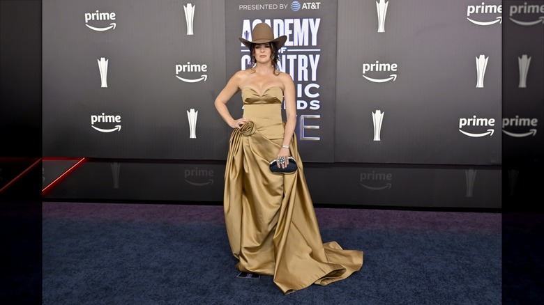 Jenna Paulette posing with hand on hips