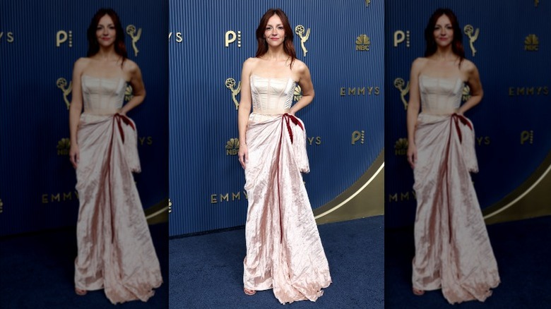 Abby Elliott wearing a pale pink dress.