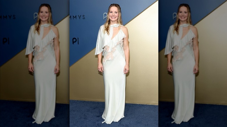 Kristen Bell wearing a white slip dress.