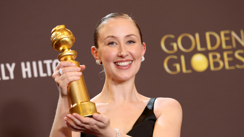 Erin Doherty poses with her Golden Globe statuette in 2026