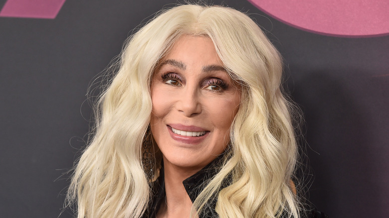 Cher poses for a photo in 2023