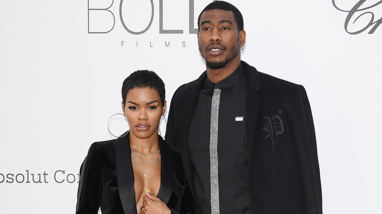 Teyana Taylor and Iman Shumpert, wearing black
