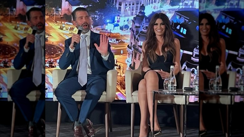 Don Jr. and Kimberly Guilfoyle speaking on stage while on a campaign trip to the Balkans