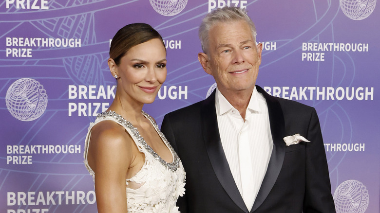 Katharine McPhee and David Foster smiling at event