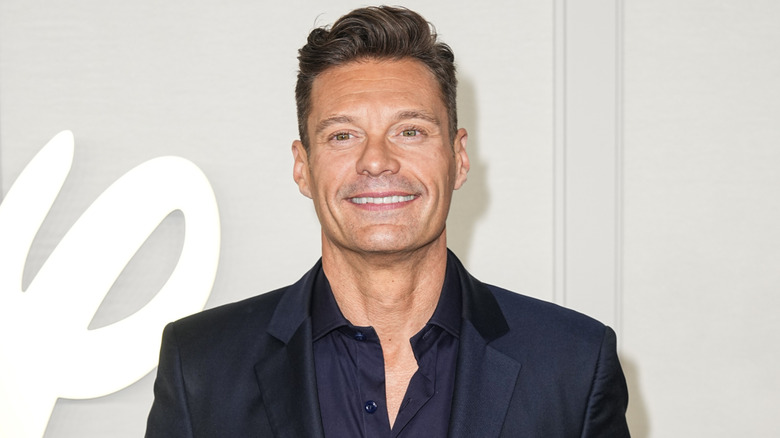 Ryan Seacrest wearing a dark blue shirt and blazer at the 2024 Disney Upfront