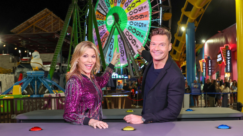 Vanna White and Ryan Seacrest pose for a photo