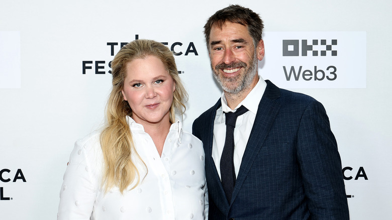 Amy Schumer and Chris Fischer attending the 
