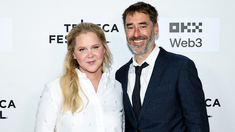 Amy Schumer and Chris Fischer attending the 