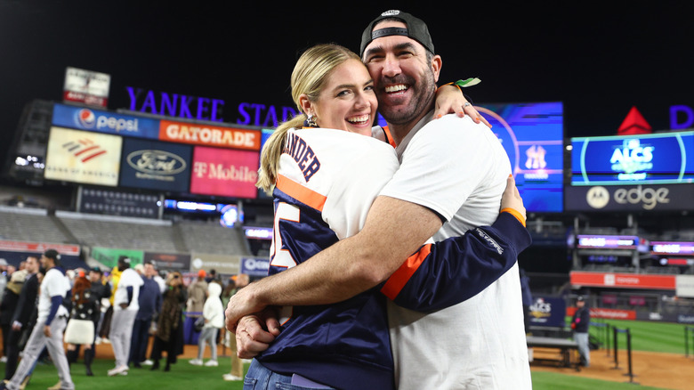 Kate Upton and Justin Verlander on the field after his 2022 World Series win.