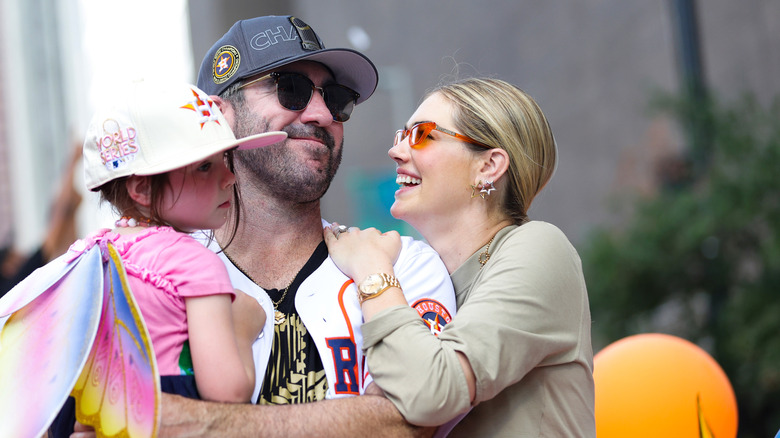 Kate Upton, Justin Verlander and child at a parade following his World Series win.