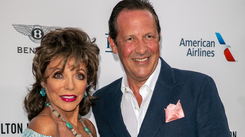 Joan Collins and her husband Percy Gibson on the red carpet